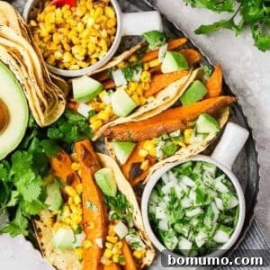 Beer marinated roasted sweet potatoes, charred corn, creamy avocado, crisp onions, and fresh cilantro, wrapped in a soft corn tortilla, make these vegetarian sweet potato tacos a taste sensation!