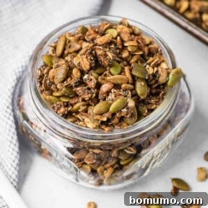 Image of granola in a jar, showcasing its crunchy texture and readiness to serve.