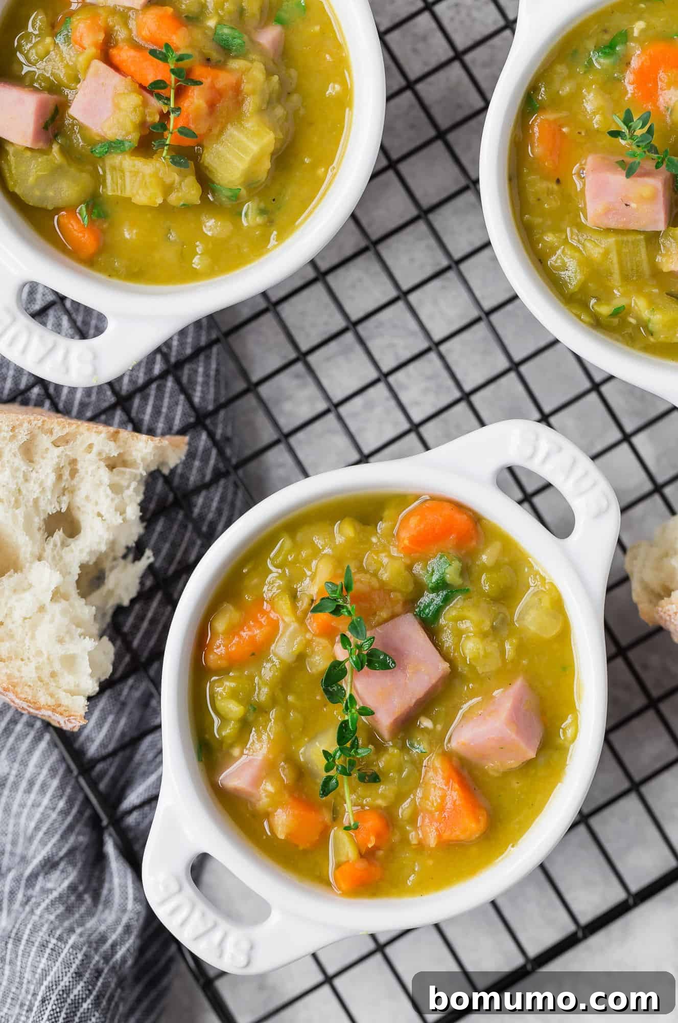 Green pea soup in small white bowls.