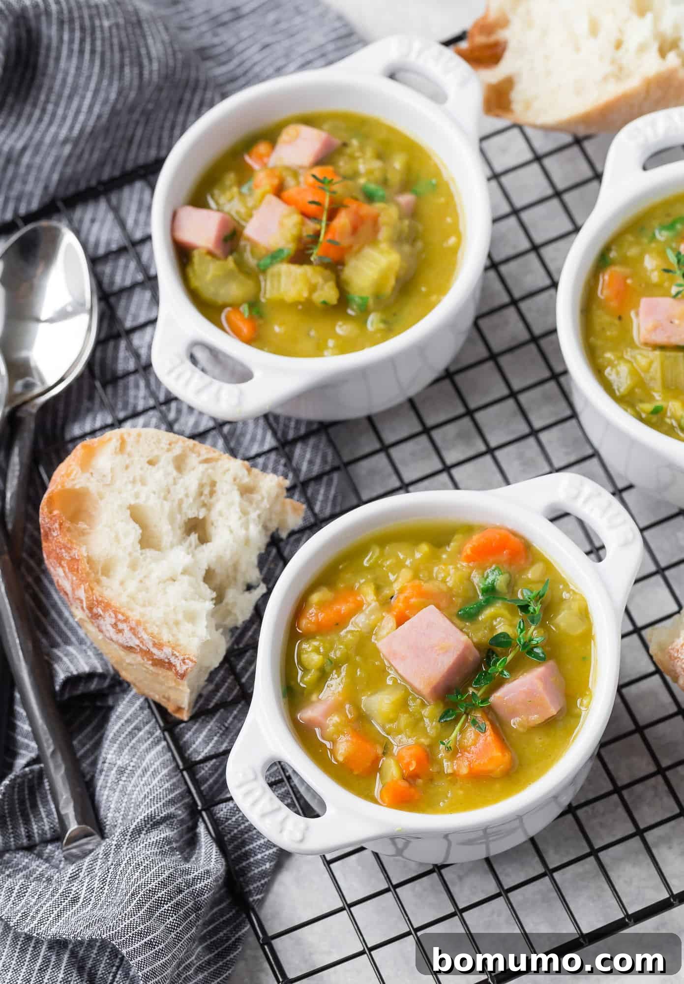 Pea soup in bowls with fresh thyme.