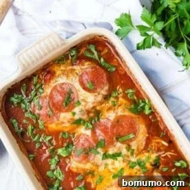 image of chicken topped with cheese and pepperoni in a baking dish, a fantastic quick dinner idea.