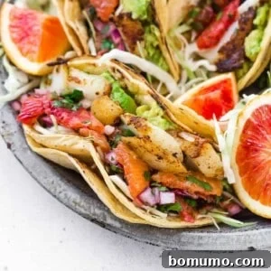Close up of fish taco in a double corn tortilla.
