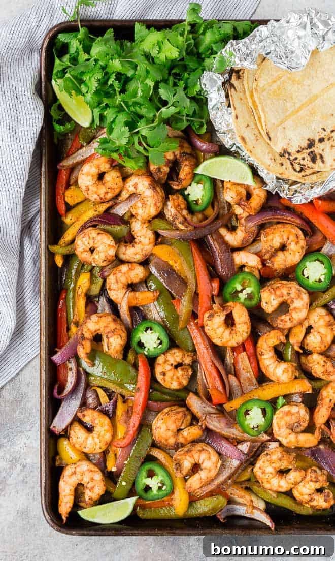 Shrimp fajitas on a sheet pan.