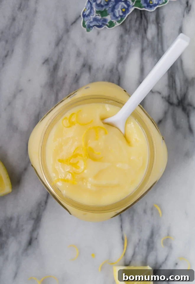 Effortless Lemon Cake Filling 4 Overhead image of bright lemon cake filling in a small jar.
