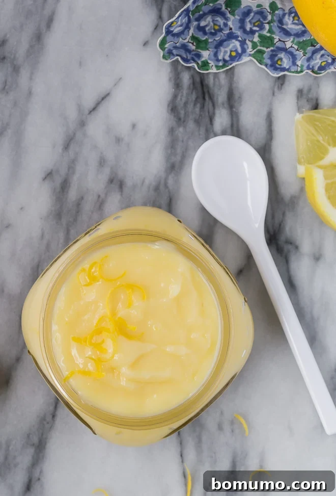 Effortless Lemon Cake Filling 5 Image of homemade cake filling made with lemons, presented in a bowl.