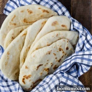 Homemade flatbread in a basket, showcasing its beautiful texture.