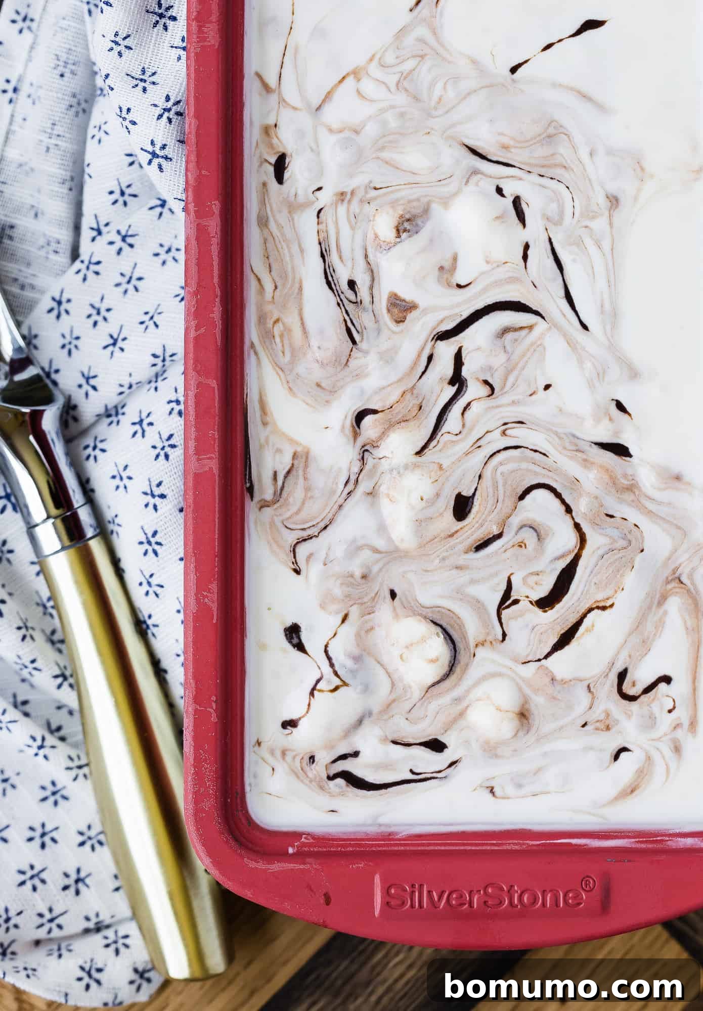 Fudge swirl ice cream in a red loaf pan.