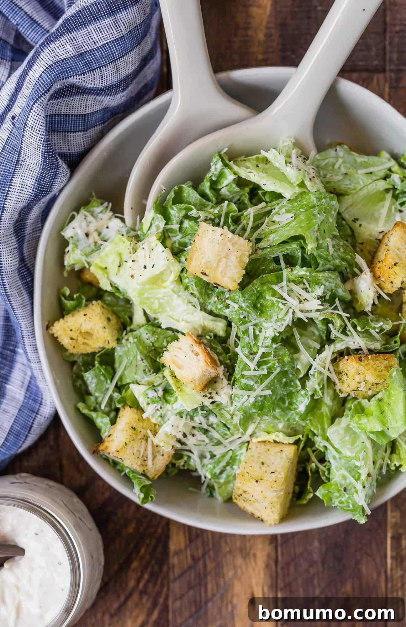 Caesar salad, viewed from above, perfectly dressed and ready to eat.