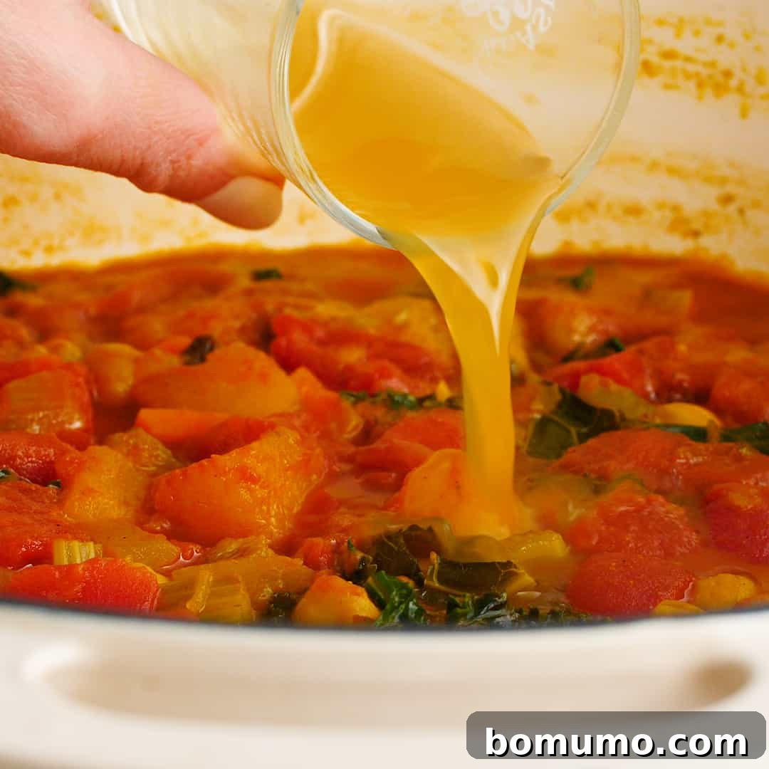 Broth being added to stew.