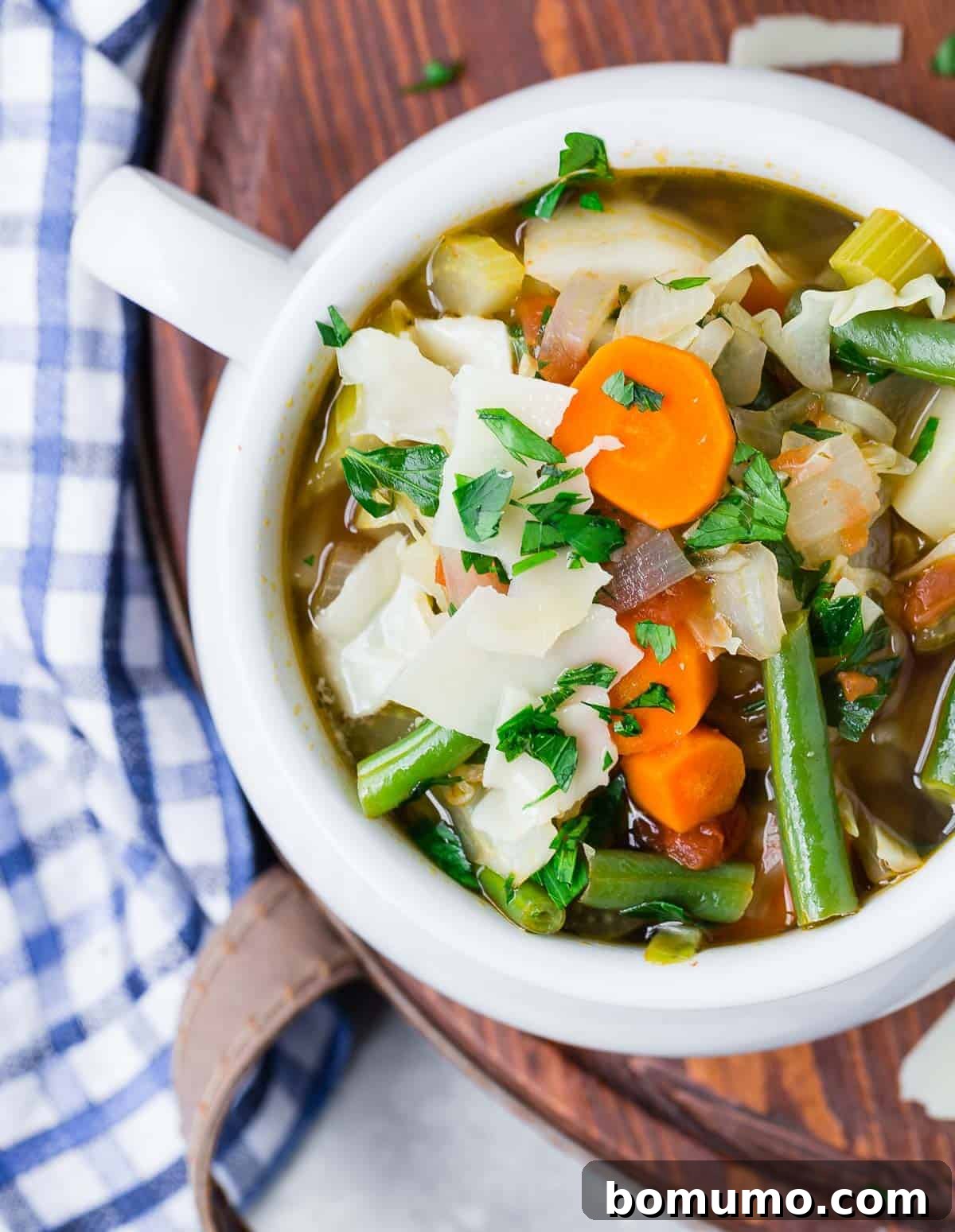 A vibrant bowl of homemade vegetable soup, showcasing its rich colors and hearty ingredients.