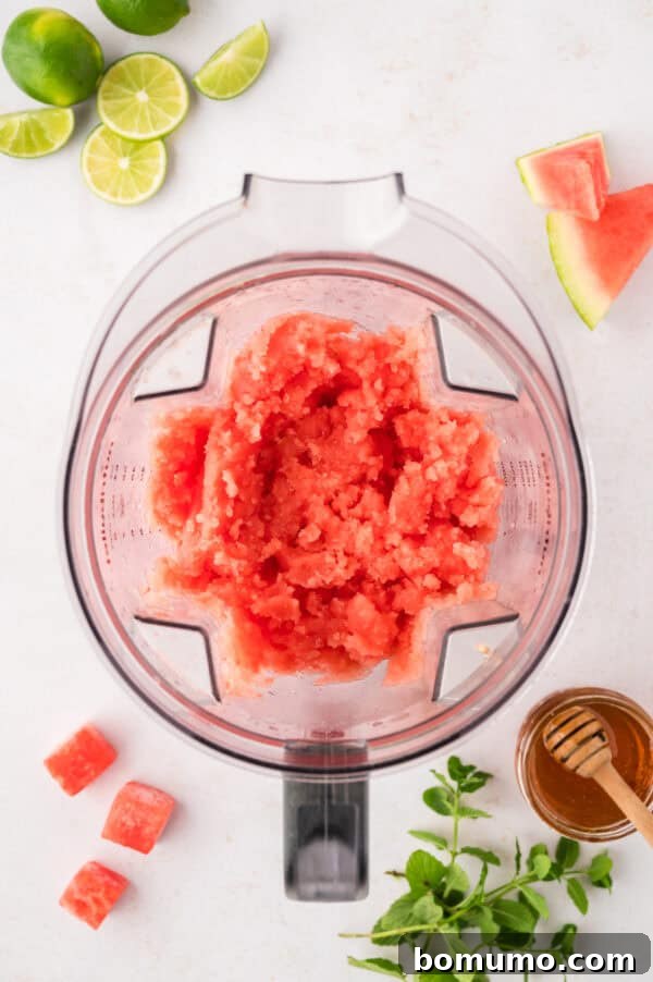 The smooth, icy texture of the watermelon slushie after being perfectly blended, ready to be poured and enjoyed.