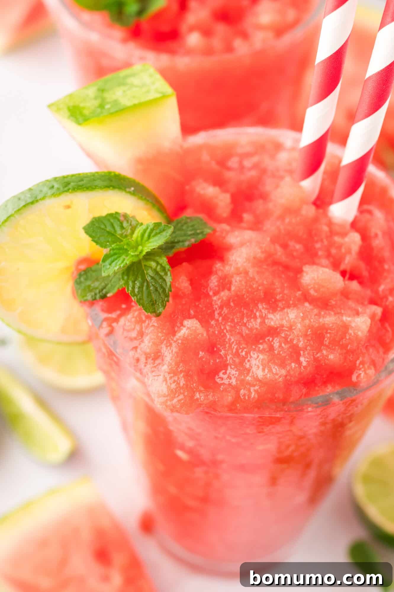 A detailed close-up shot focusing on the smooth, icy, and perfectly blended texture of the watermelon slushie.