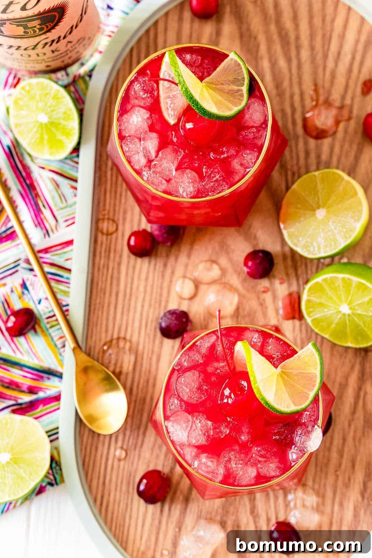 An overhead shot showcasing two bright red Bay Breeze cocktails, perfectly served over ice.