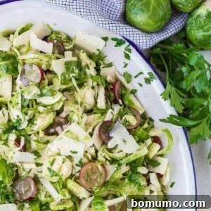 Close up of brussels sprouts salad with grapes.