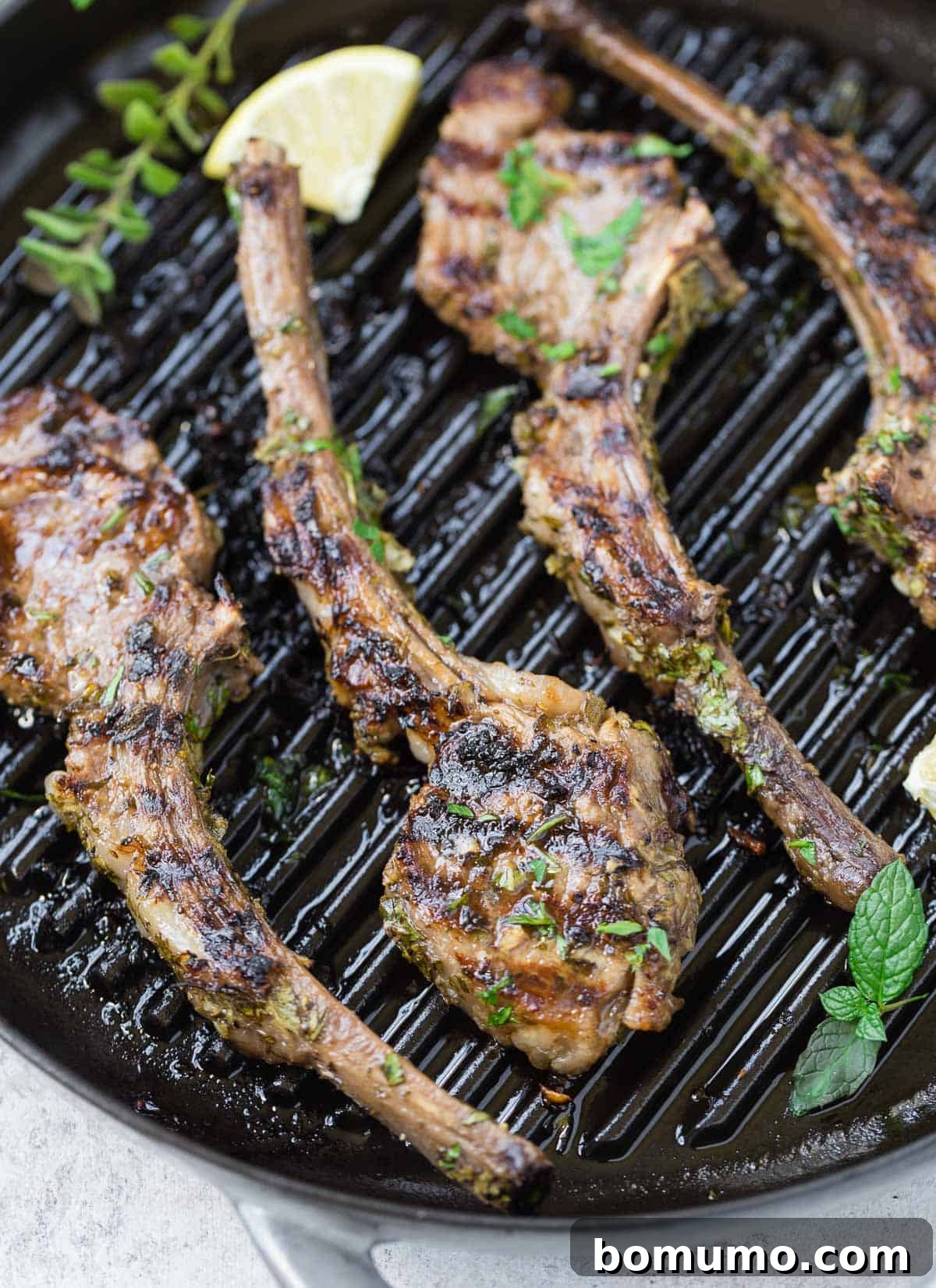 Aromatic Garlic Herb Lamb Chops 6 Vibrant herb-marinated lamb chops sizzling on a hot grill pan, promising a delicious outcome.