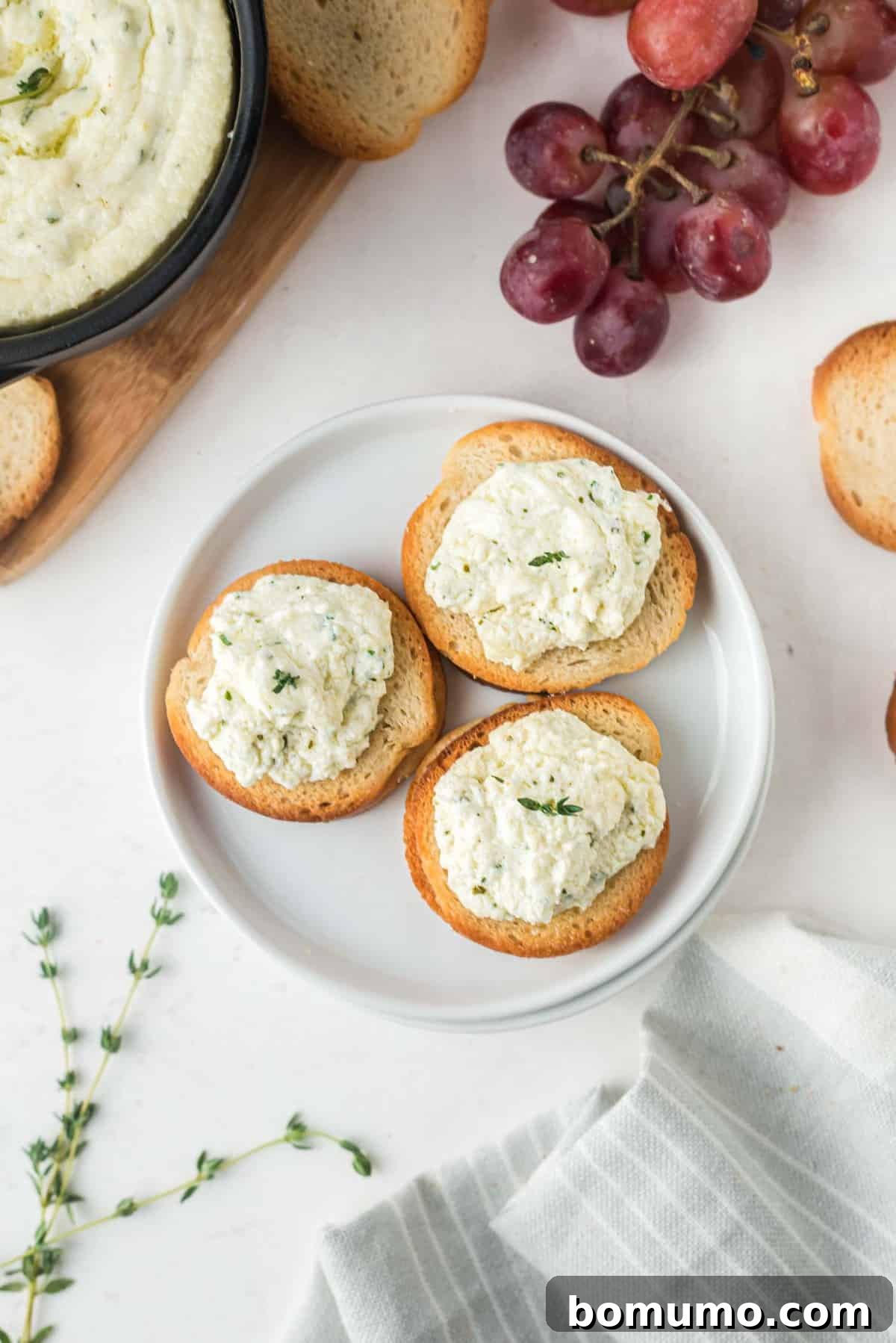 Goat cheese spread on small crostini.