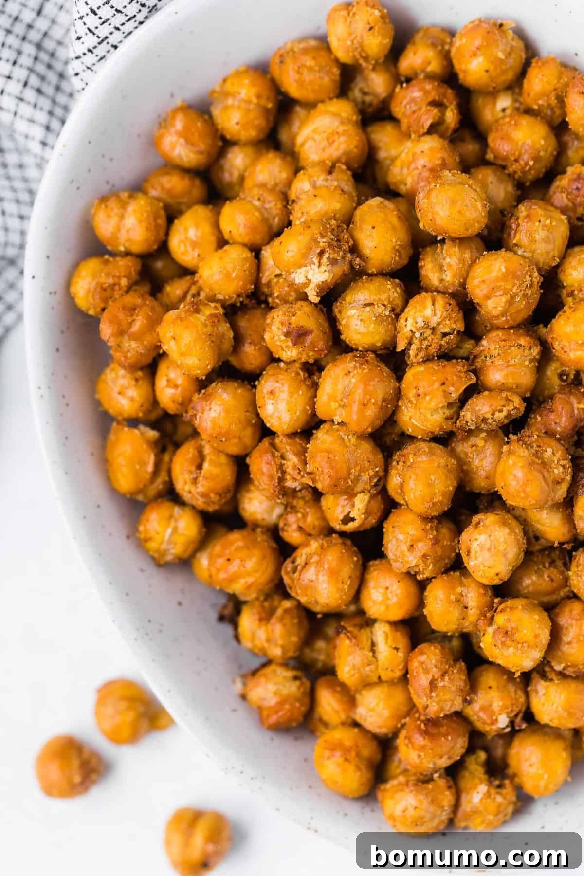 Crispy chickpeas in a white bowl, overhead view.