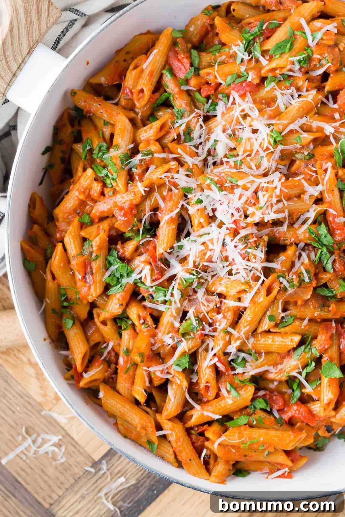 Close up of whole wheat penne in a tomato sauce.