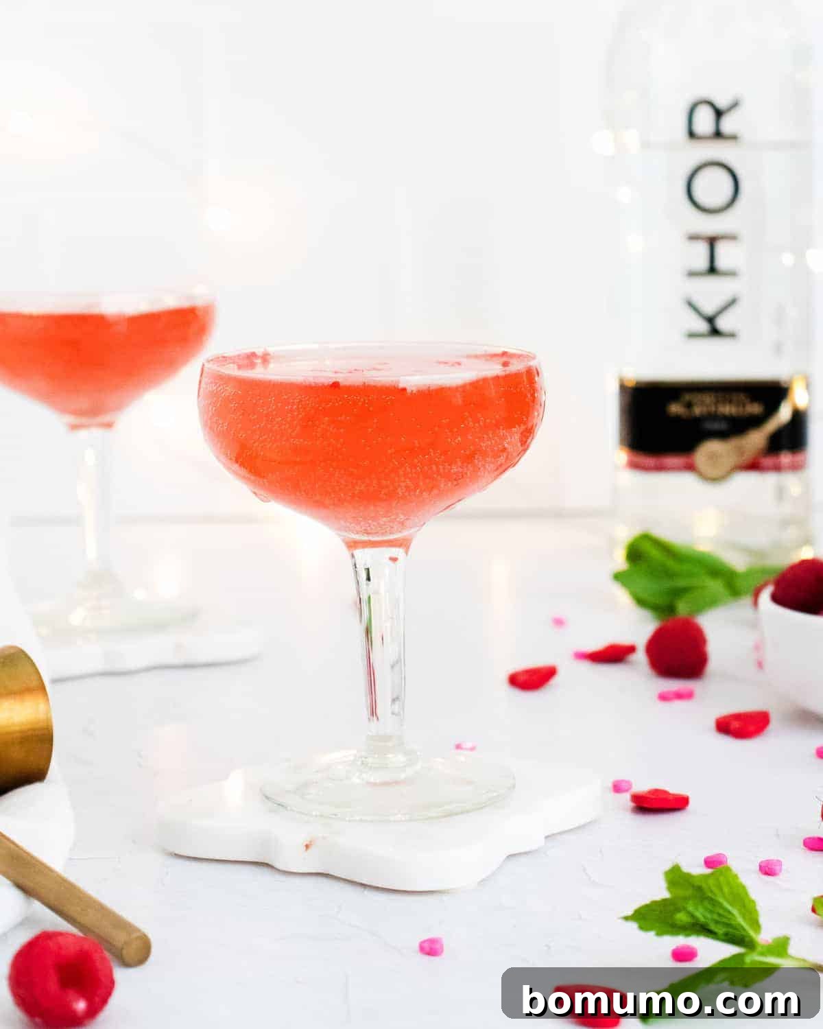 Two glasses of sparkling rosé, beautifully presented and ready to be enjoyed.