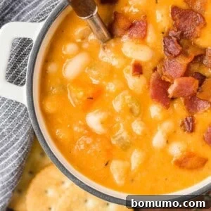 Versatile Bean and Bacon Soup 8 A delightful bowl of bean and bacon soup, rich and creamy, crowned with crispy bacon bits, ready to be savored.