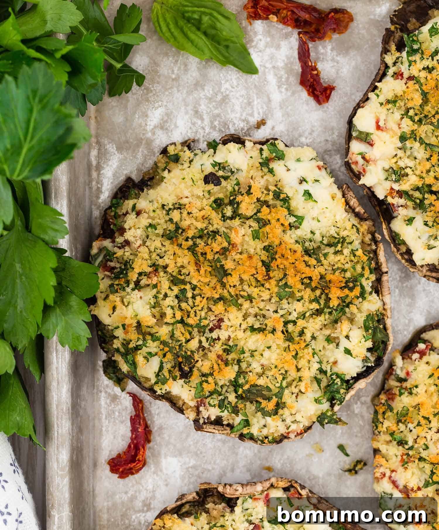 Stuffed Portobello Delight 11 Overhead view of a cooked mushroom with filling and golden brown breadcrumb topping.