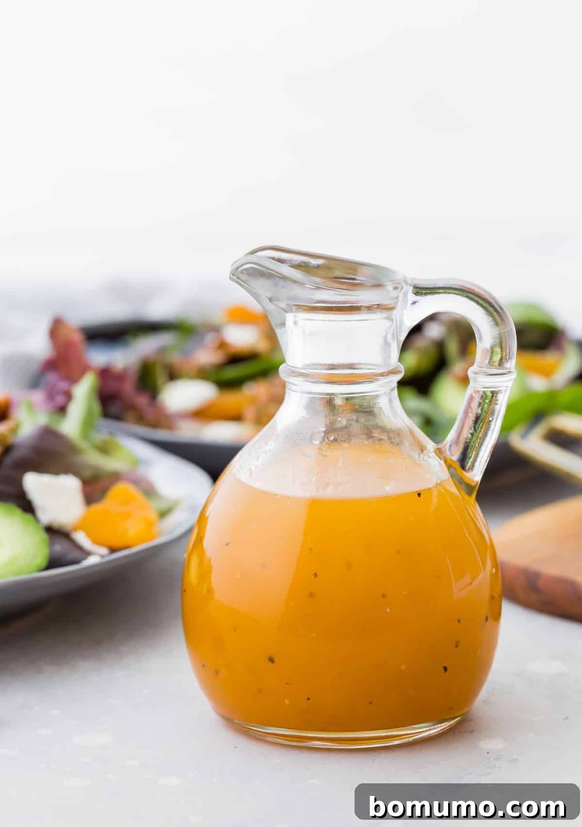 Apricot vinaigrette in a small glass pitcher.