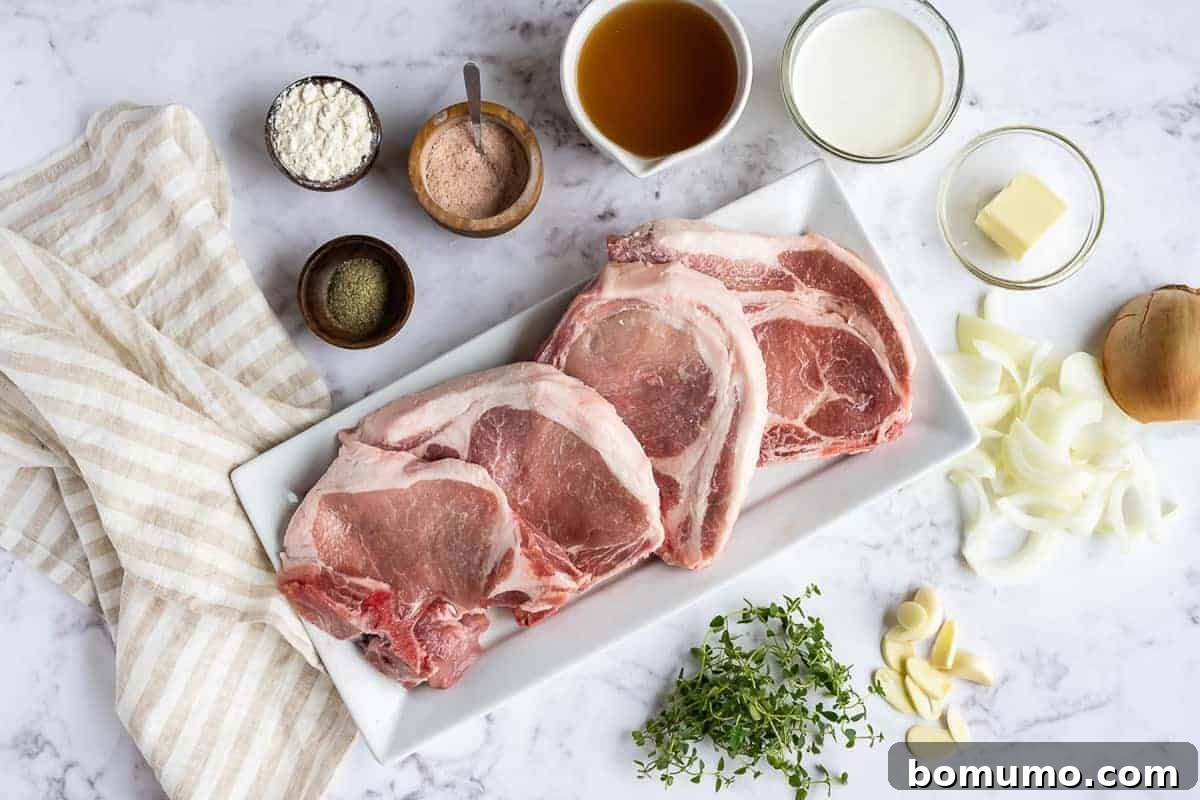 An overhead view of various fresh ingredients laid out on a kitchen counter, including thick-cut pork chops, spices, sliced onions, fresh thyme sprigs, heavy cream, and mushrooms.