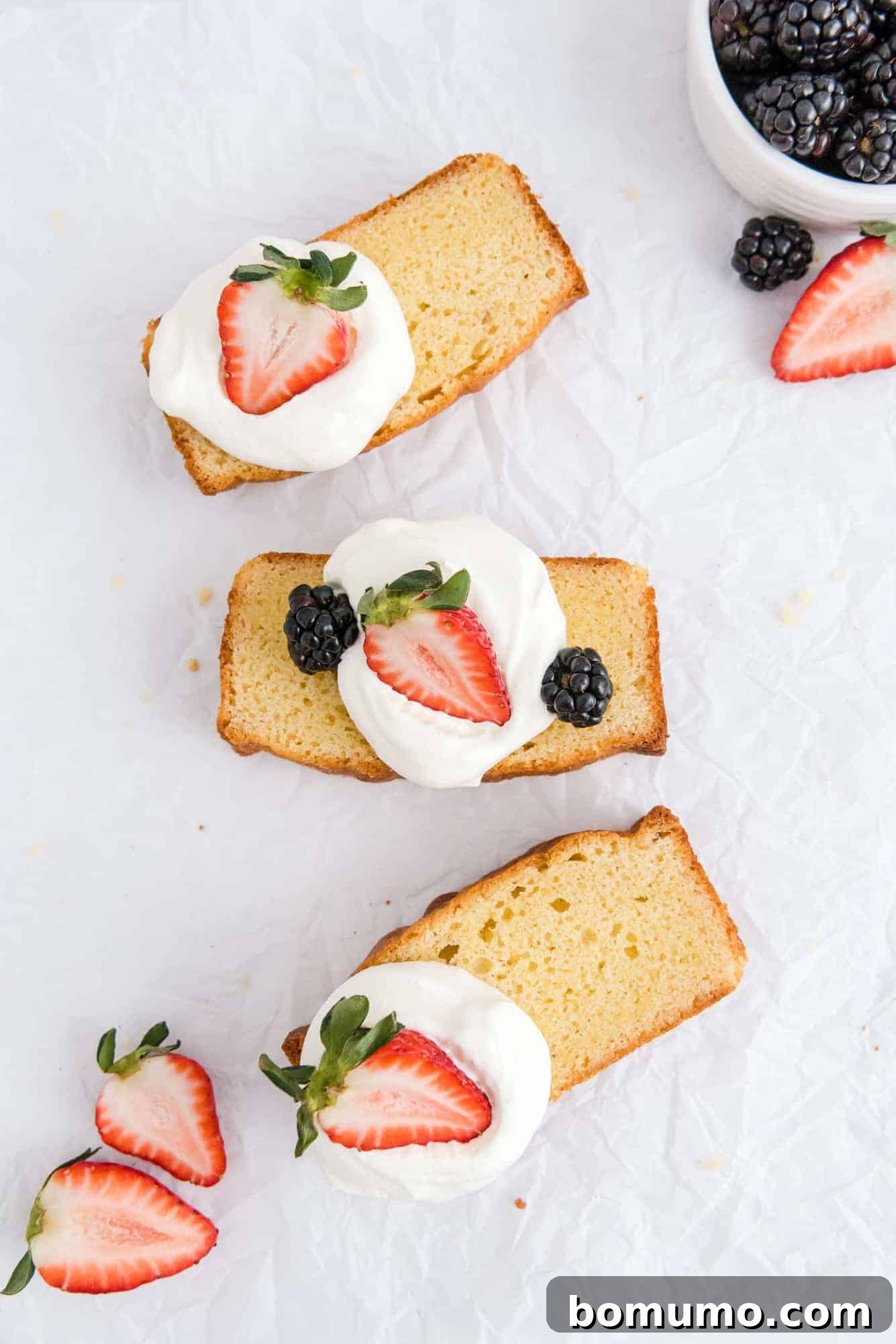 Timeless Pound Cake Perfection 3 Perfectly baked slices of pound cake arranged neatly on a pristine white background, highlighting their golden crust and fine crumb.