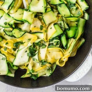 Zucchini ribbons beautifully combined with summer squash ribbons in a well-seasoned pan.