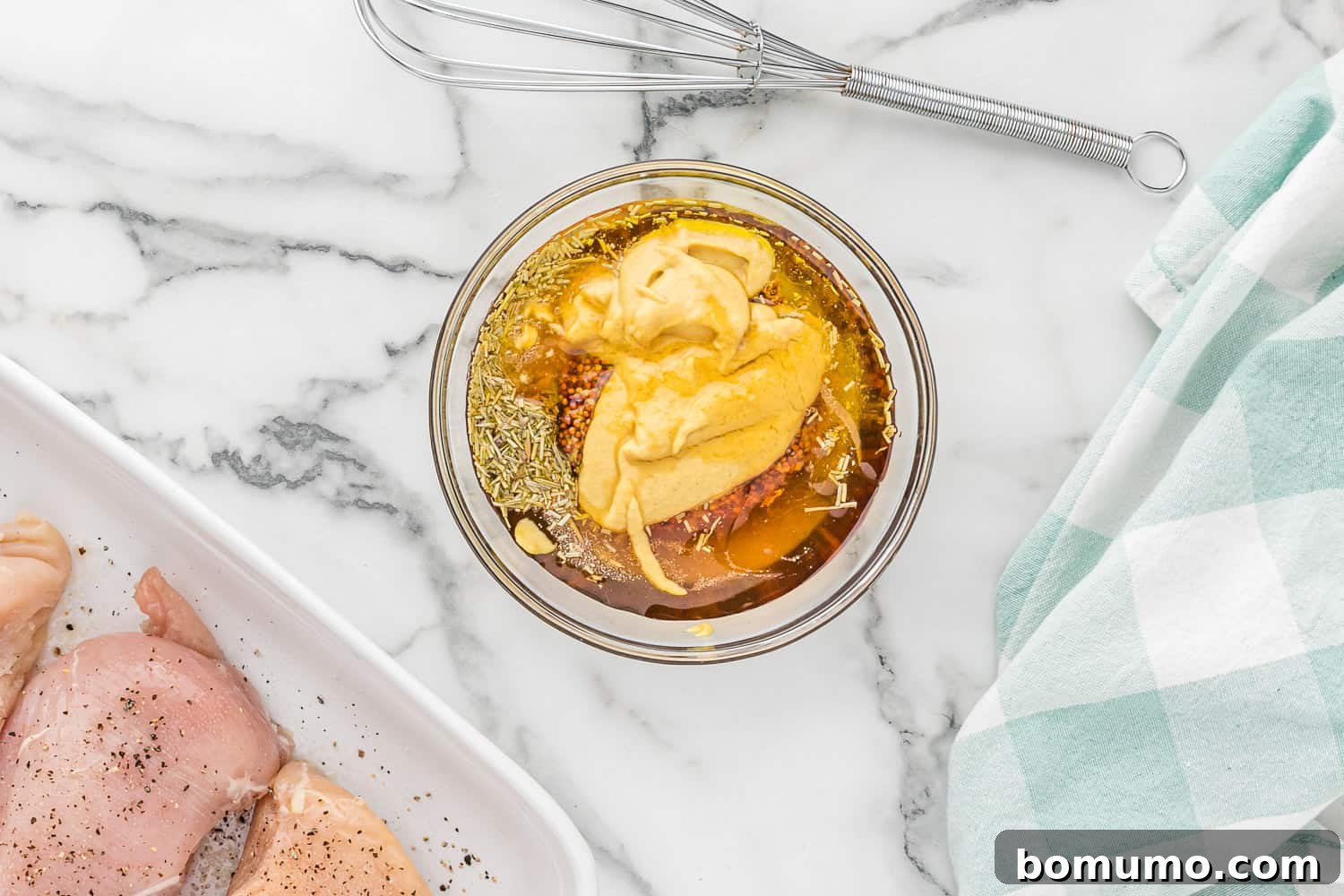Delicious sauce ingredients beautifully combined in a small glass bowl, ready for the chicken.