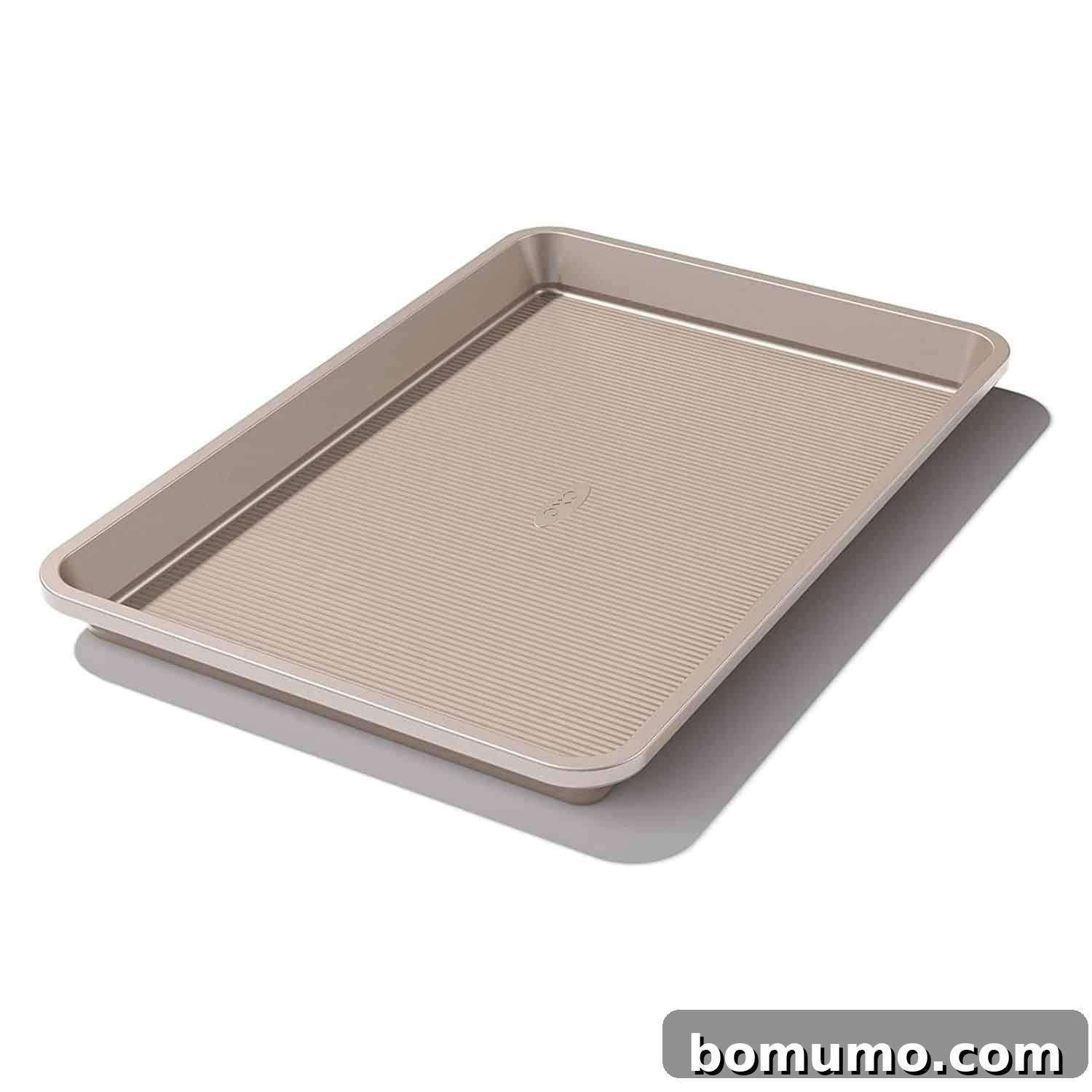 A sturdy, silver non-stick jelly roll pan, essential for baking a perfect Texas Sheet Cake.