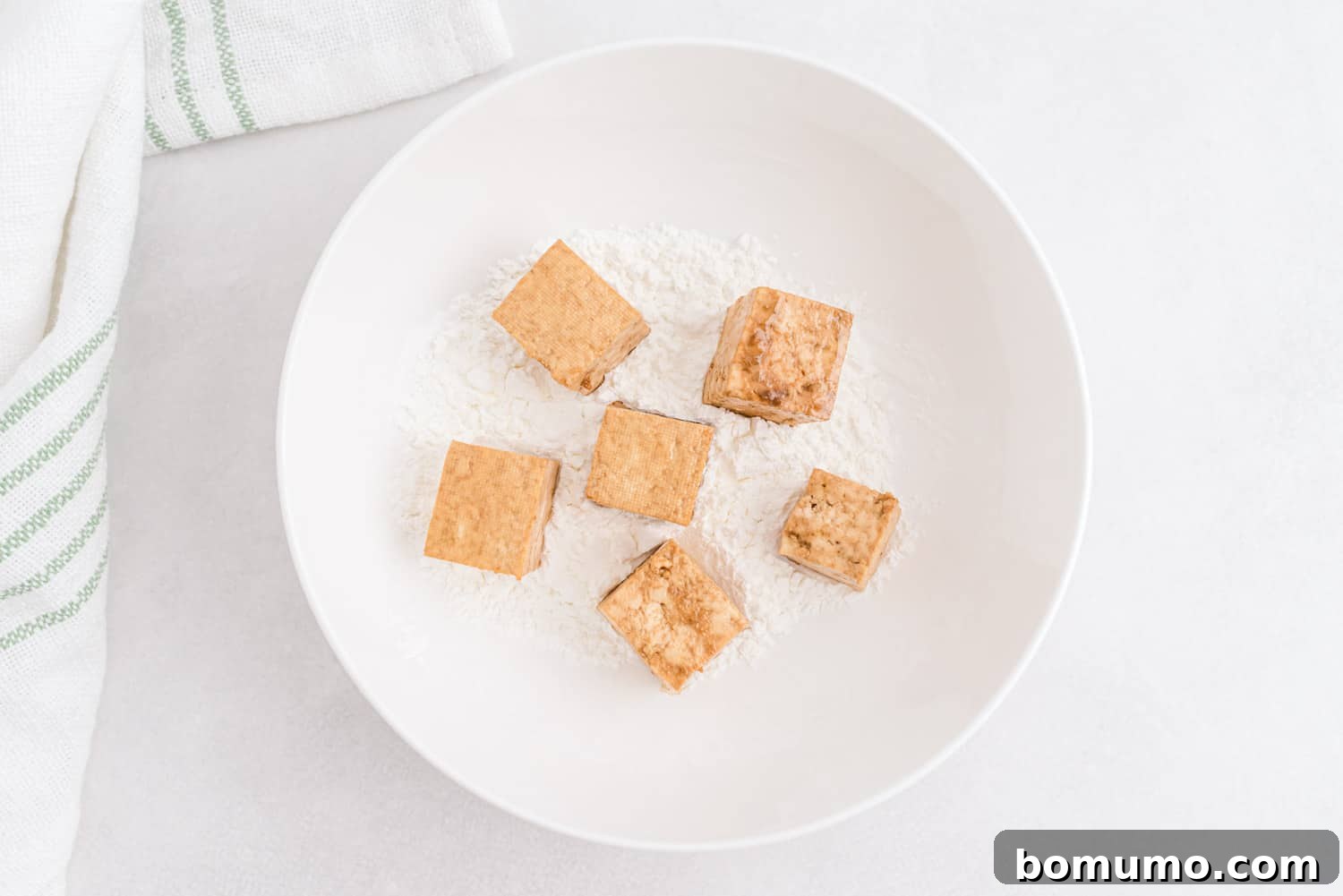Tofu tossed with cornstarch.