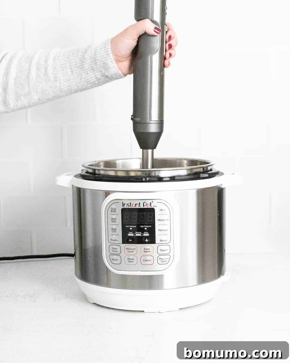 Soup in an Instant Pot being pureed.