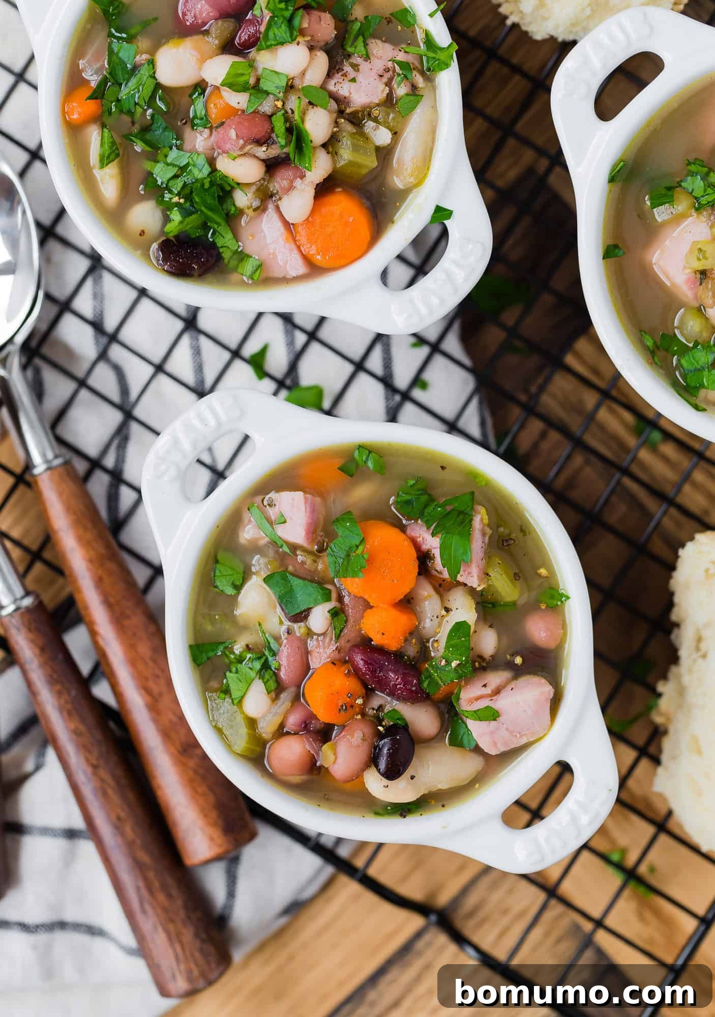Bean and ham soup with vegetables and parsley.