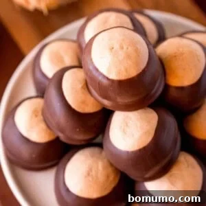 Close up view of buckeye candies made with peanut butter and dipped in chocolate.