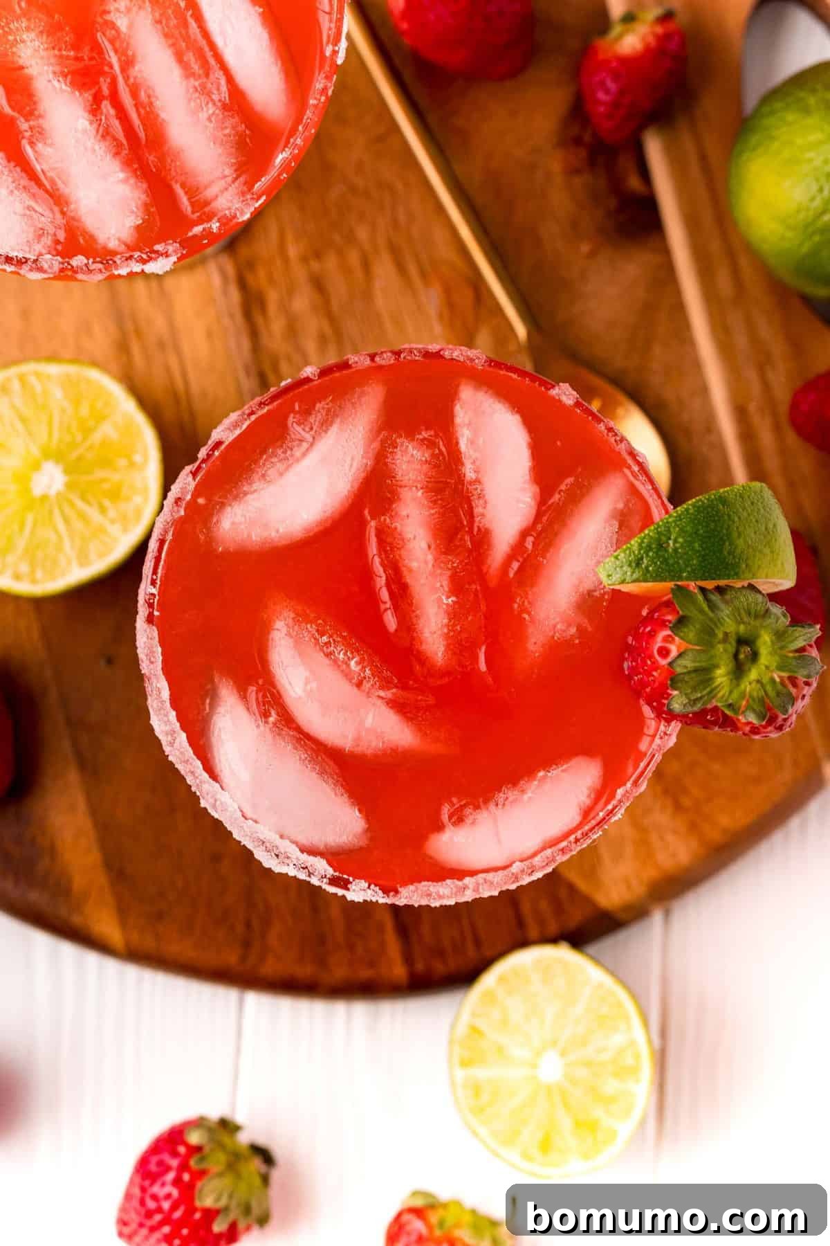 Overhead view of red punch with ice.