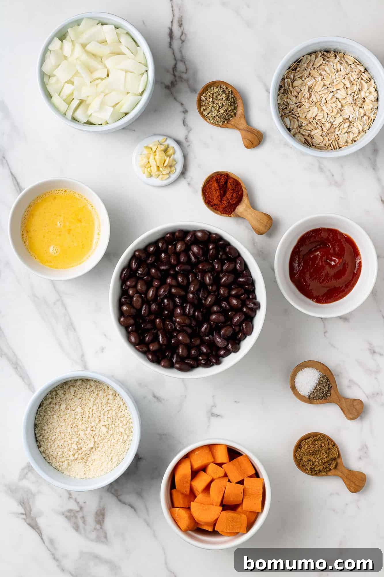 Savory Black Bean Bliss 4 An overhead shot showcasing all the fresh and wholesome ingredients laid out on a clean surface, ready to be combined for the black bean burgers.