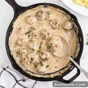 Swedish meatballs in a black cast iron pan.