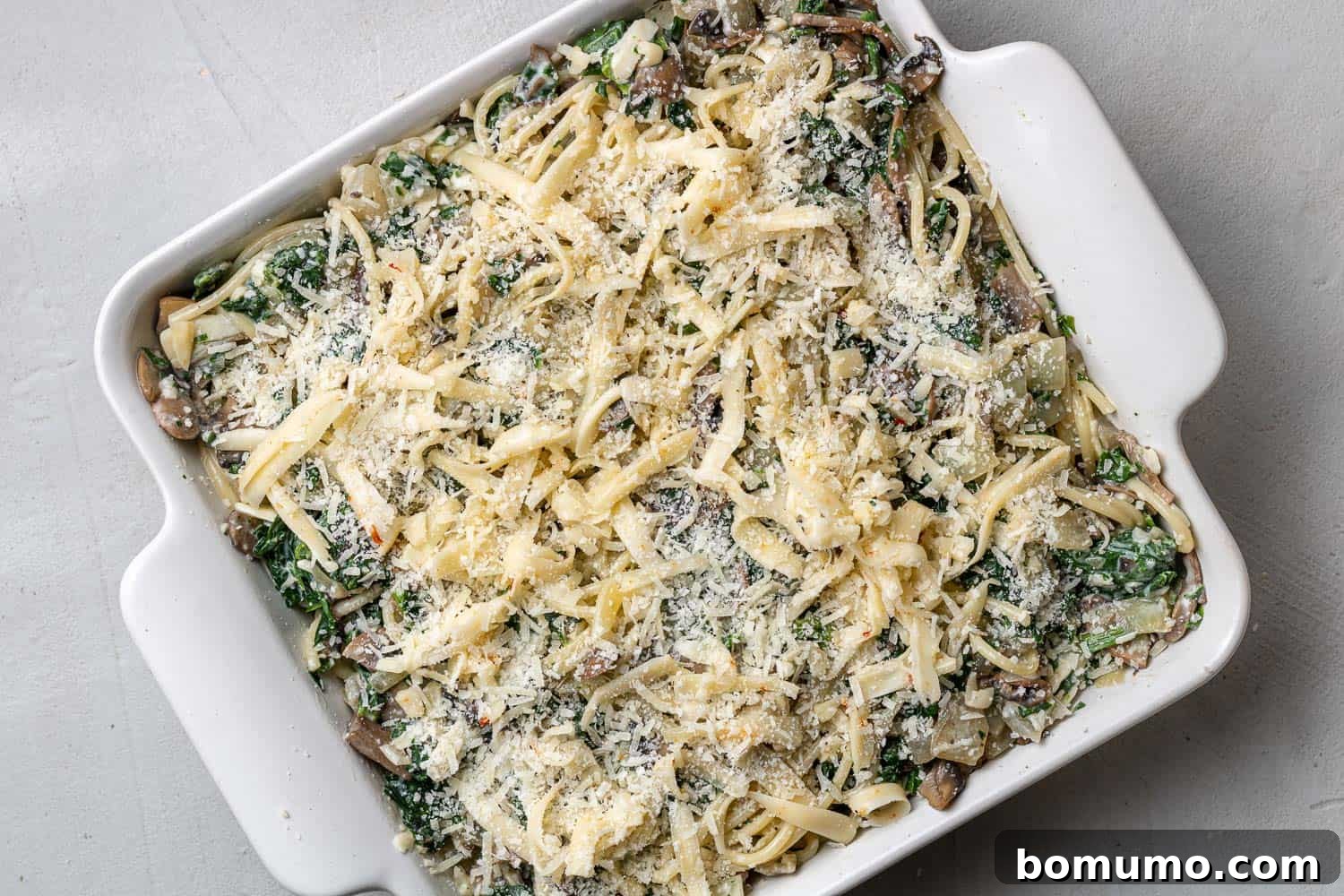 Cheesy Spinach Baked Spaghetti 8 Spinach spaghetti topped with cheese.