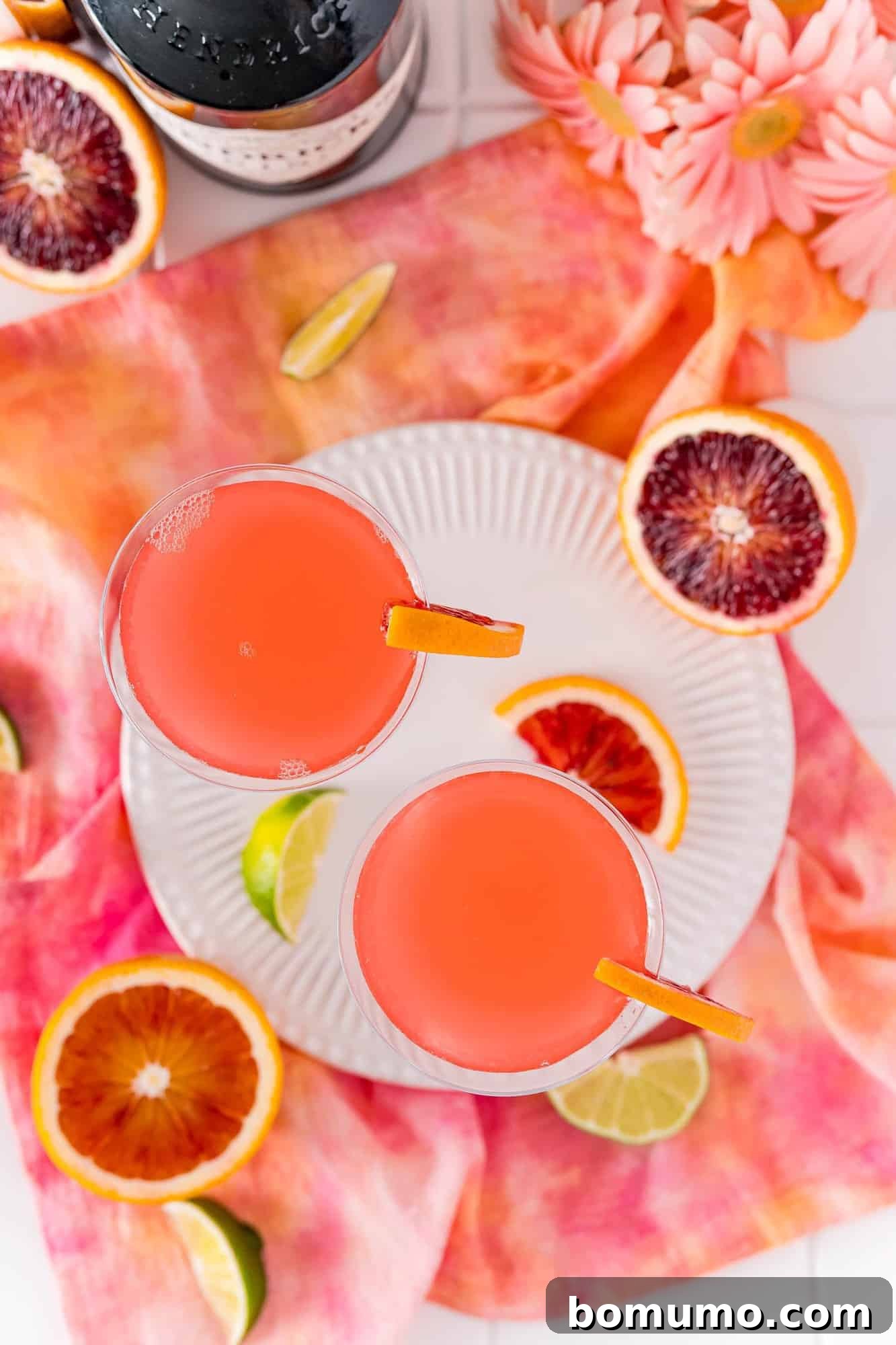 Blood Moon Martini 7 An overhead view showcasing two stunning blood orange martinis, each perfectly garnished and ready to be enjoyed.