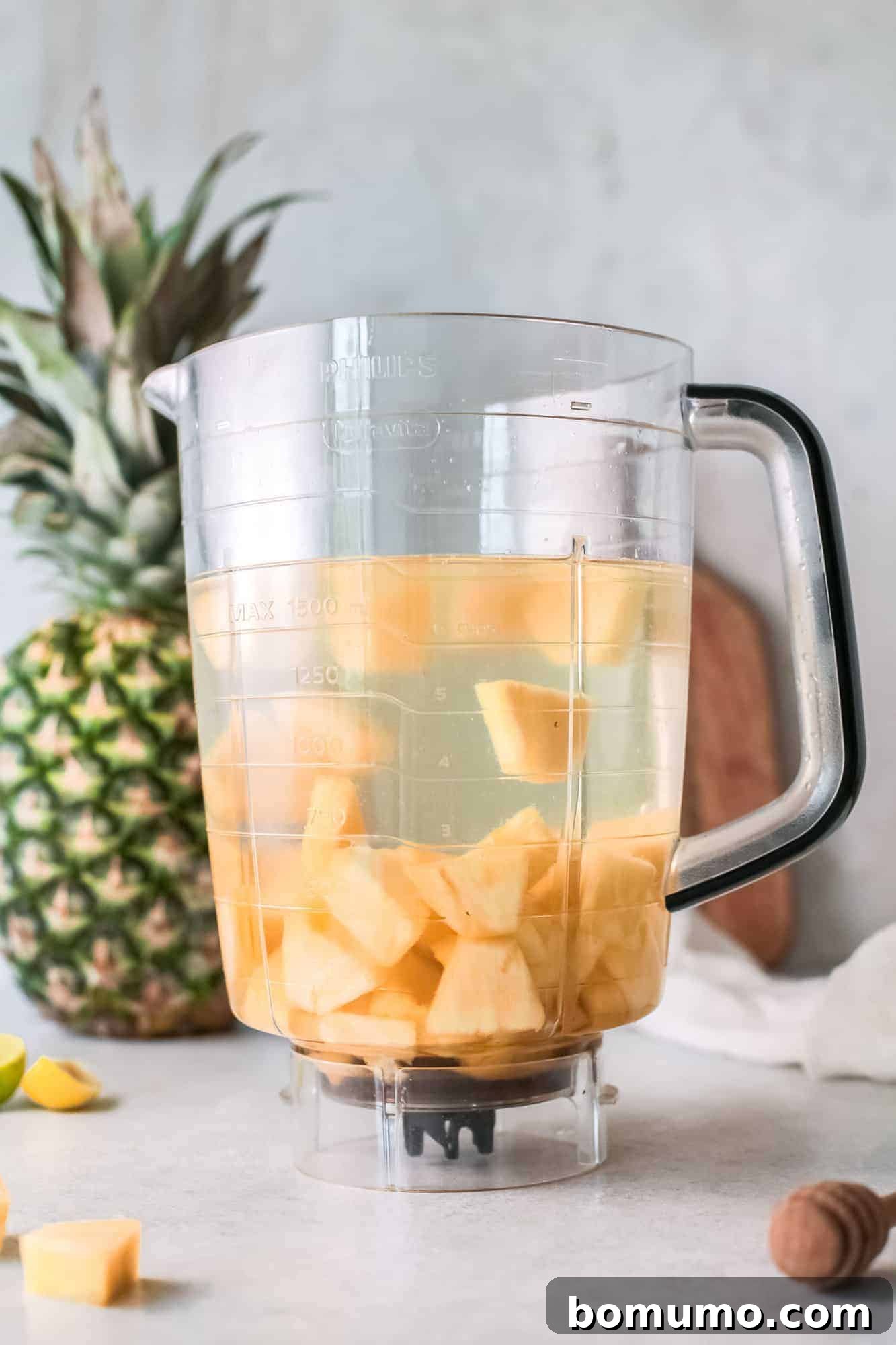 Pineapple Agua Fresca 4 Diced pineapple and water in a blender, ready for processing.