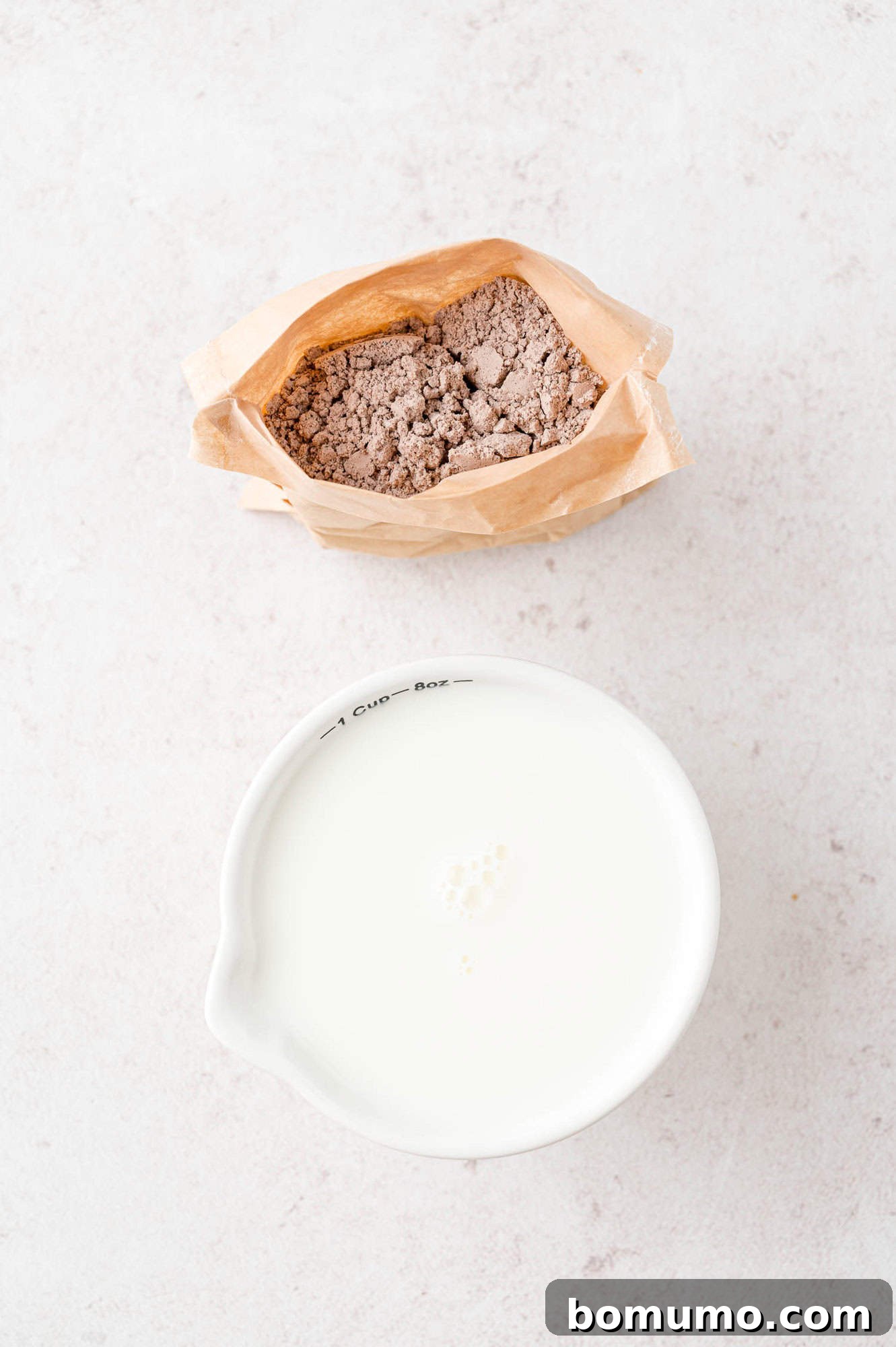The two essential ingredients for homemade pudding pops: instant pudding mix and fresh milk.
