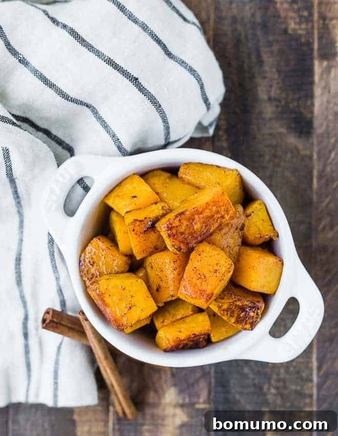 A vibrant assortment of various winter squashes, showcasing their diverse shapes, colors, and textures, ready for cooking.