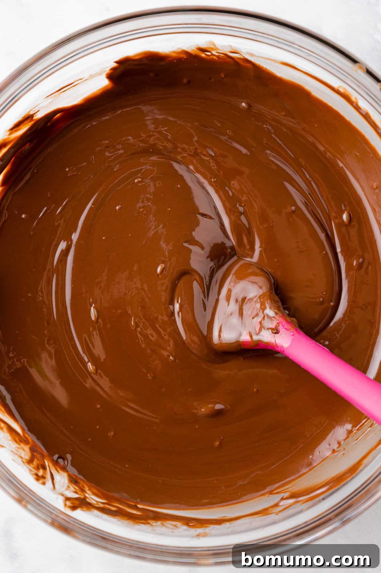 Velvet Dipped Mallows 9 Smooth, melted chocolate and coconut oil mixture in a bowl.