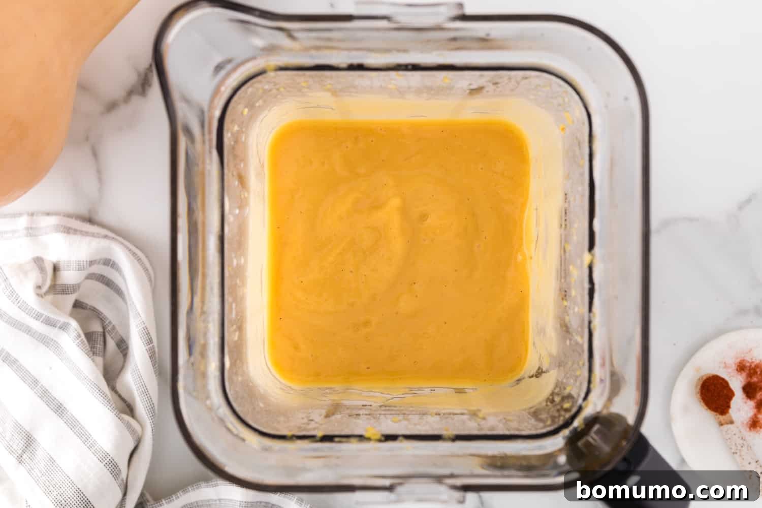 Perfectly smooth butternut squash soup in a blender after processing.