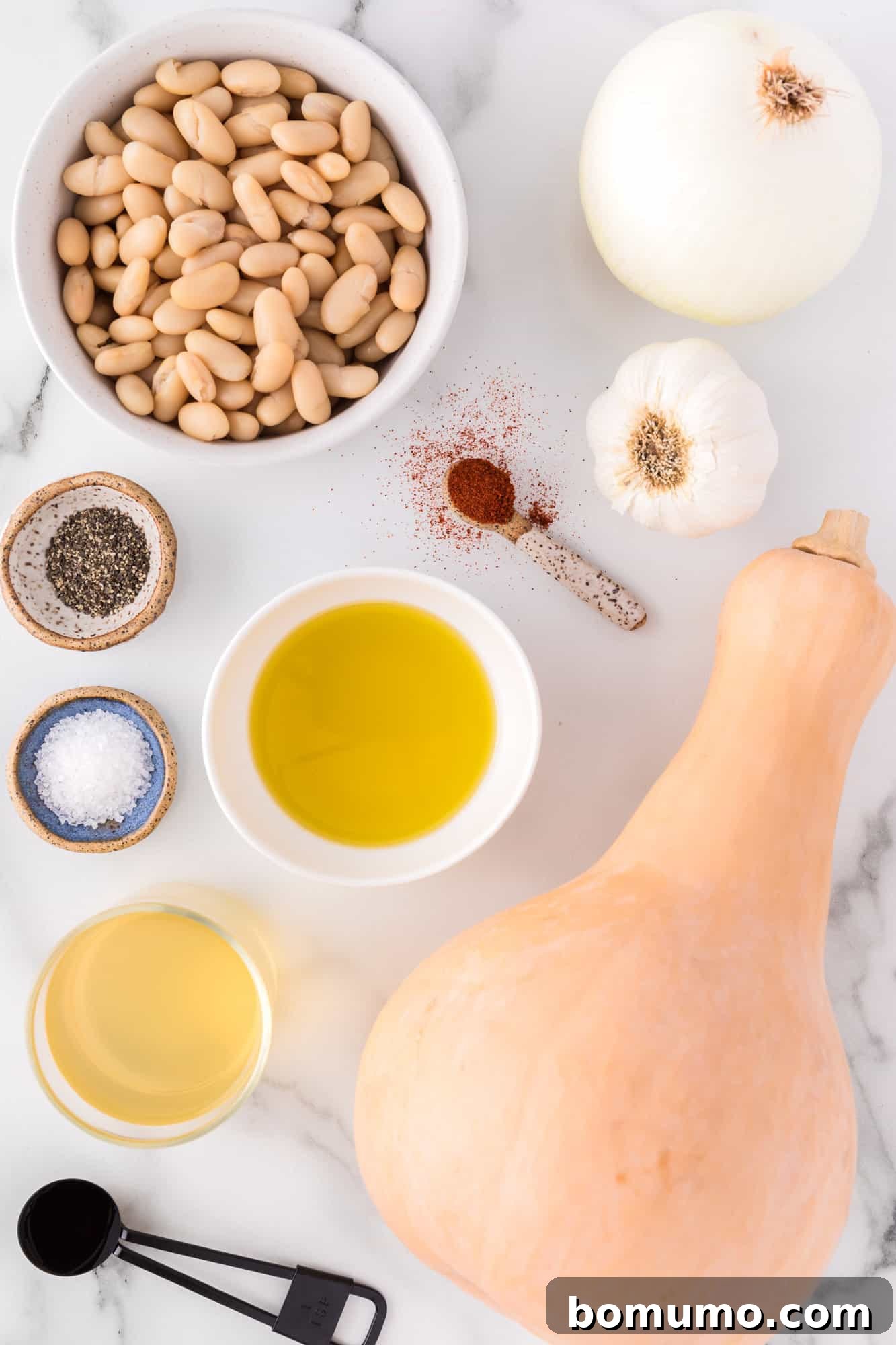 A vibrant selection of fresh ingredients, including a whole butternut squash, ready for the recipe.