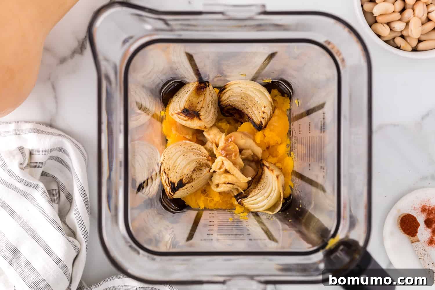 Roasted onions and soft, roasted garlic cloves added to the blender with the squash.