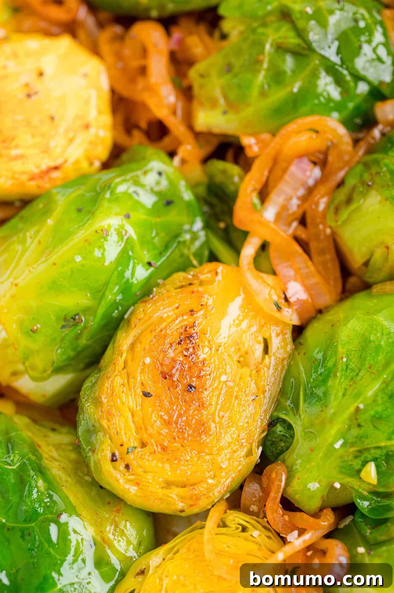 A close-up view of sautéed Brussels sprouts infused with smoked paprika and tender shallots, ready to be served.