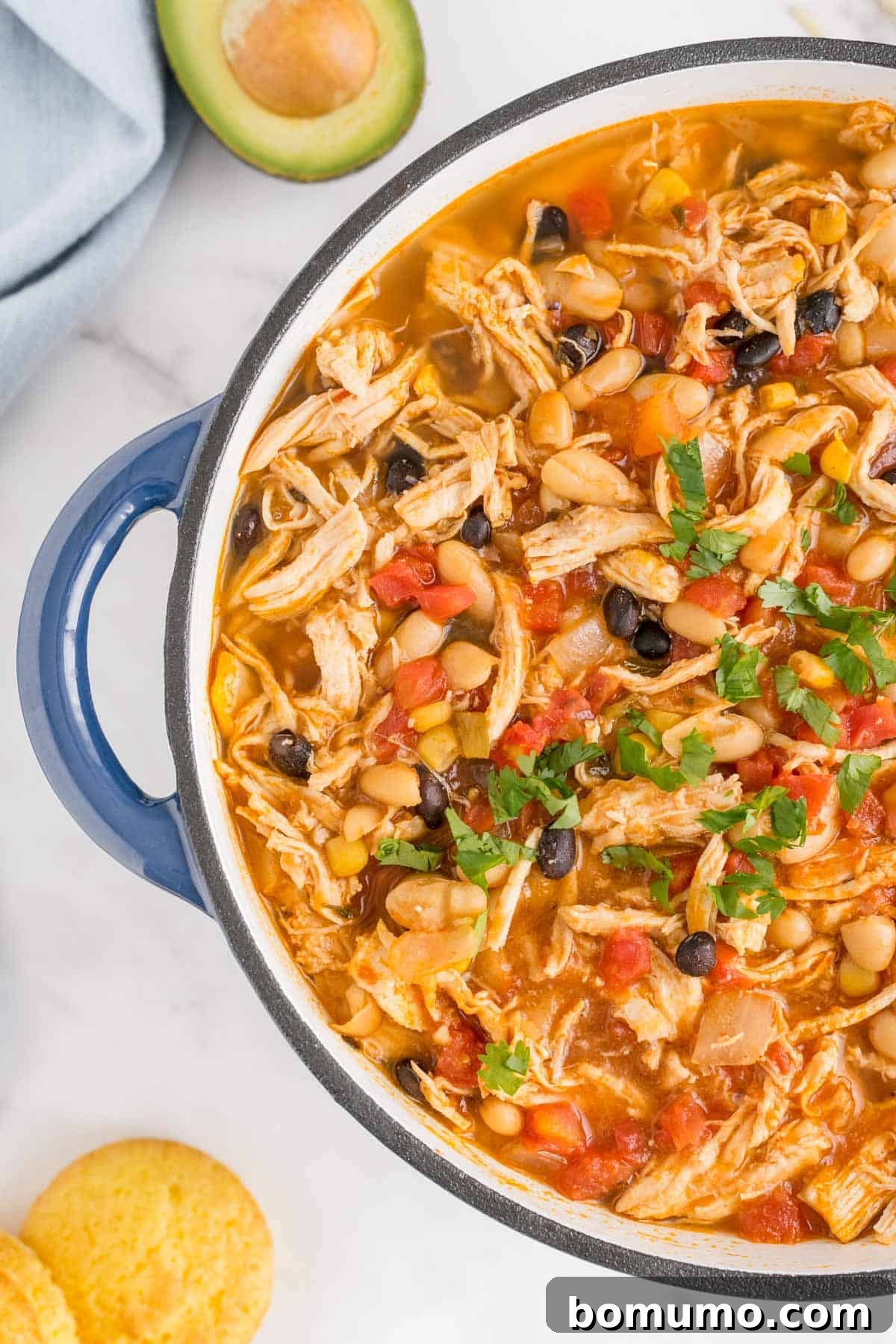 White chili in a large blue pot.