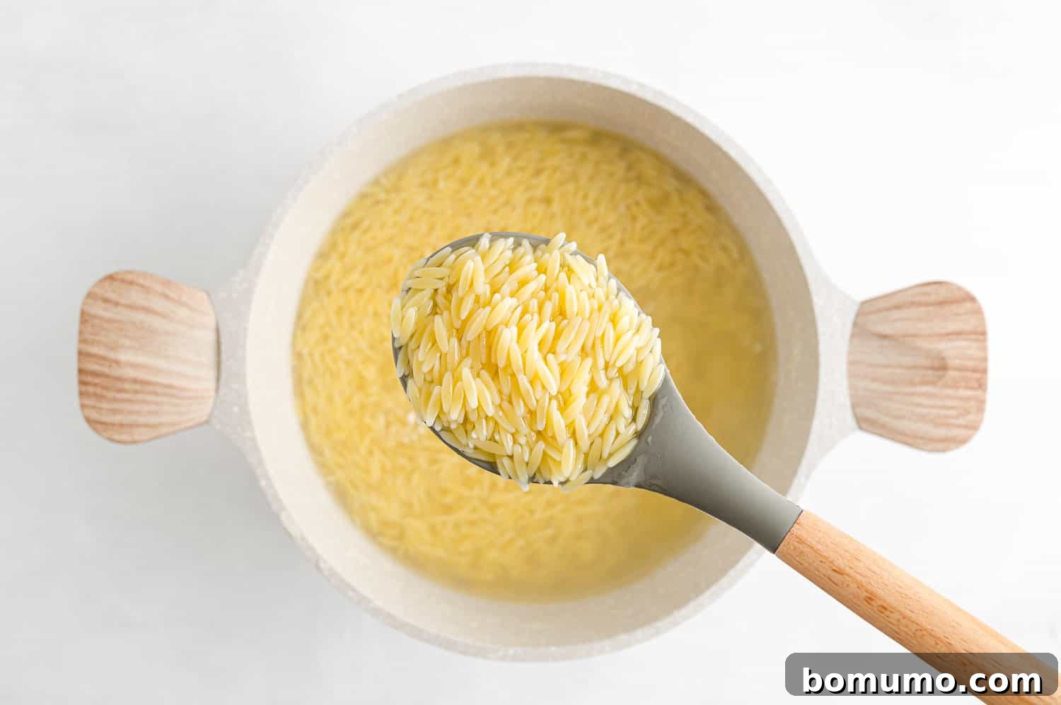 Two images: one shows cooked orzo pasta on a wooden spoon, and the other shows a pot of perfectly cooked orzo, ready for draining.
